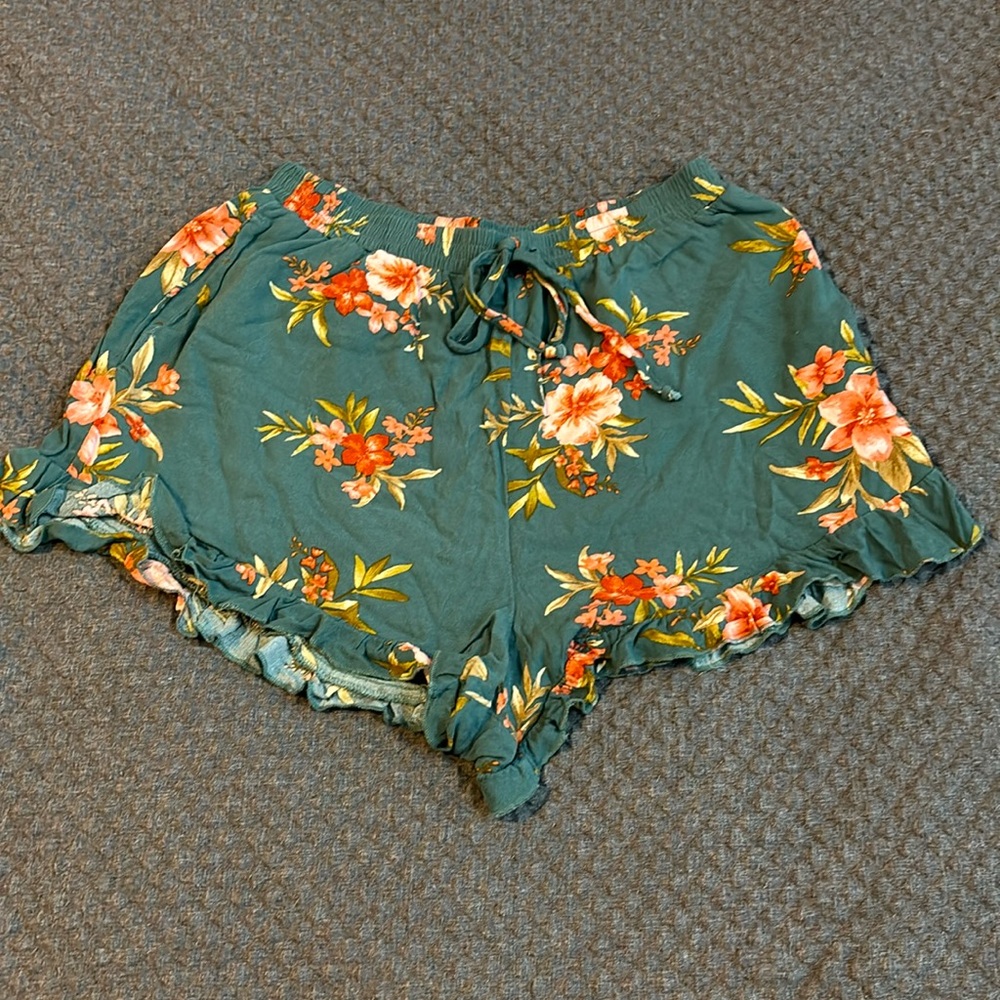 American Eagle green and floral ruffled shorts.